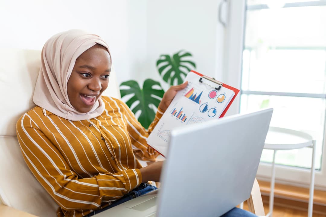 Young student learning on laptop